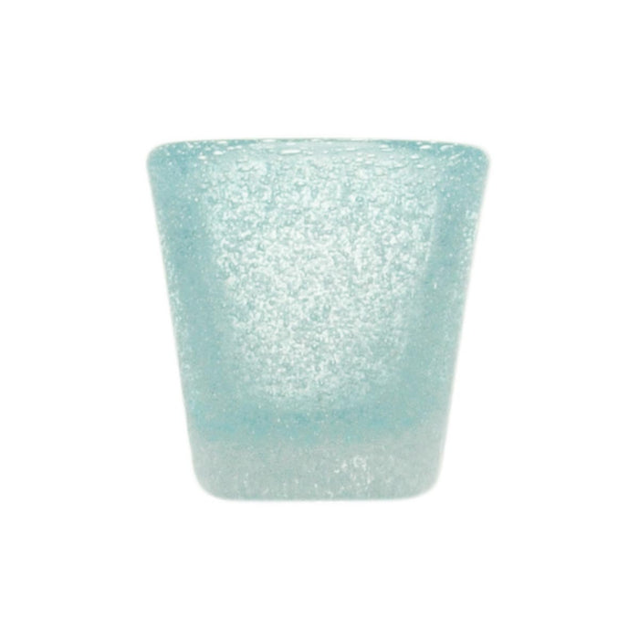 Small bitter glass in blue glass